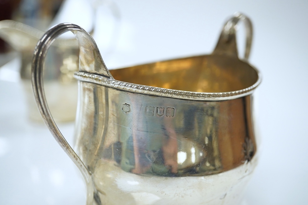 A late Victorian three piece silver teaset of oval form, London 1896, gross 21oz. Good condition.